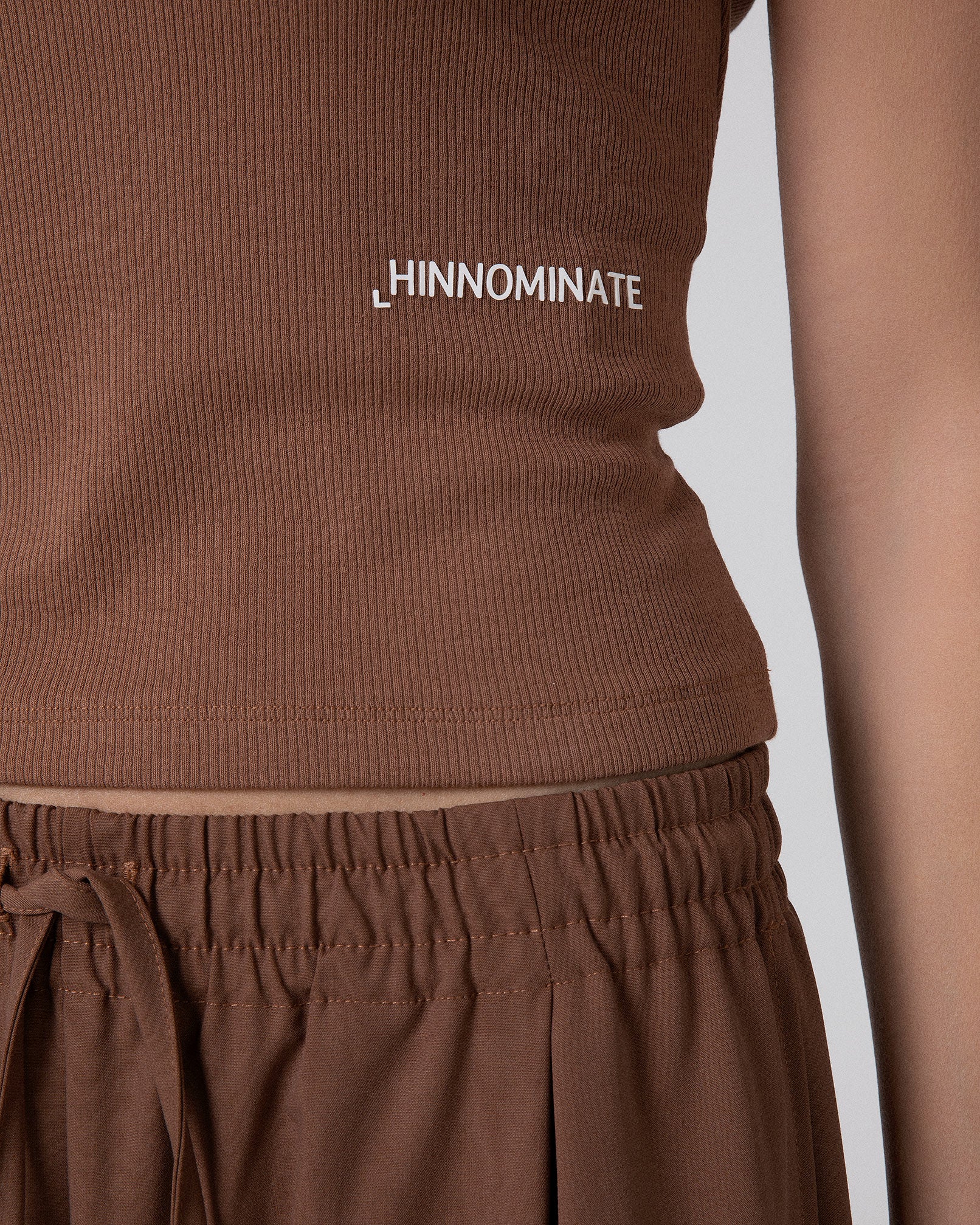CROP TOP A CANOTTA IN COSTINA CON BOTTONI SUL DAVANTI