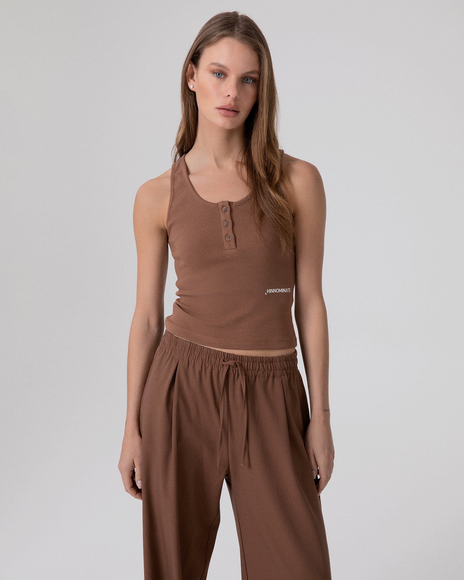 CROP TOP A CANOTTA IN COSTINA CON BOTTONI SUL DAVANTI